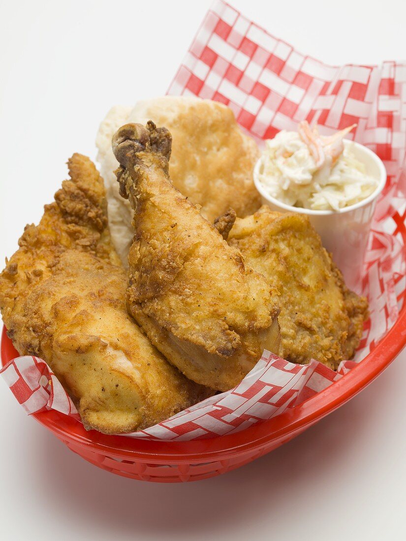 Fried chicken with coleslaw and scone in plastic basket