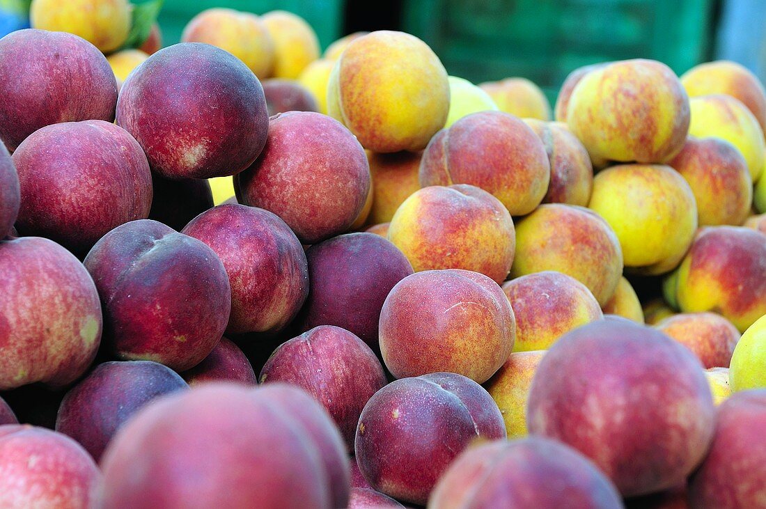 Fresh peaches on a market stall