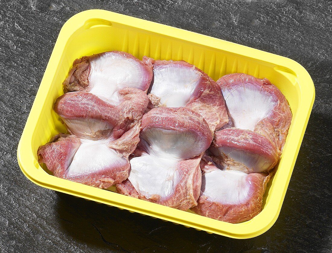 Turkey stomachs in plastic container