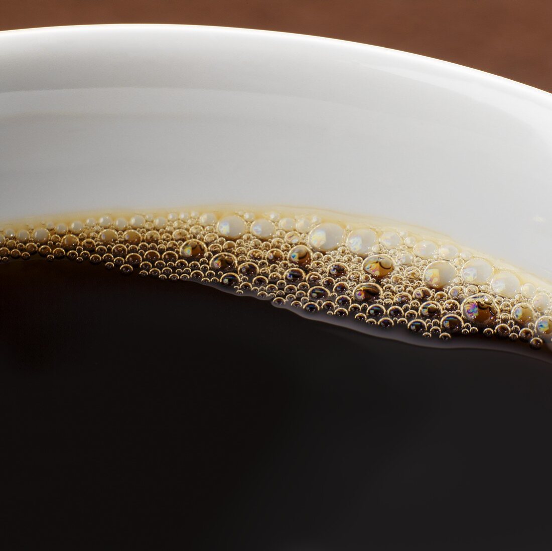 Black coffee in cup (close-up)
