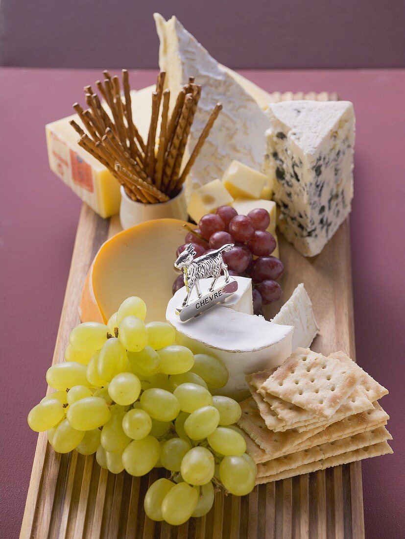 Cheese board with grapes and nibbles