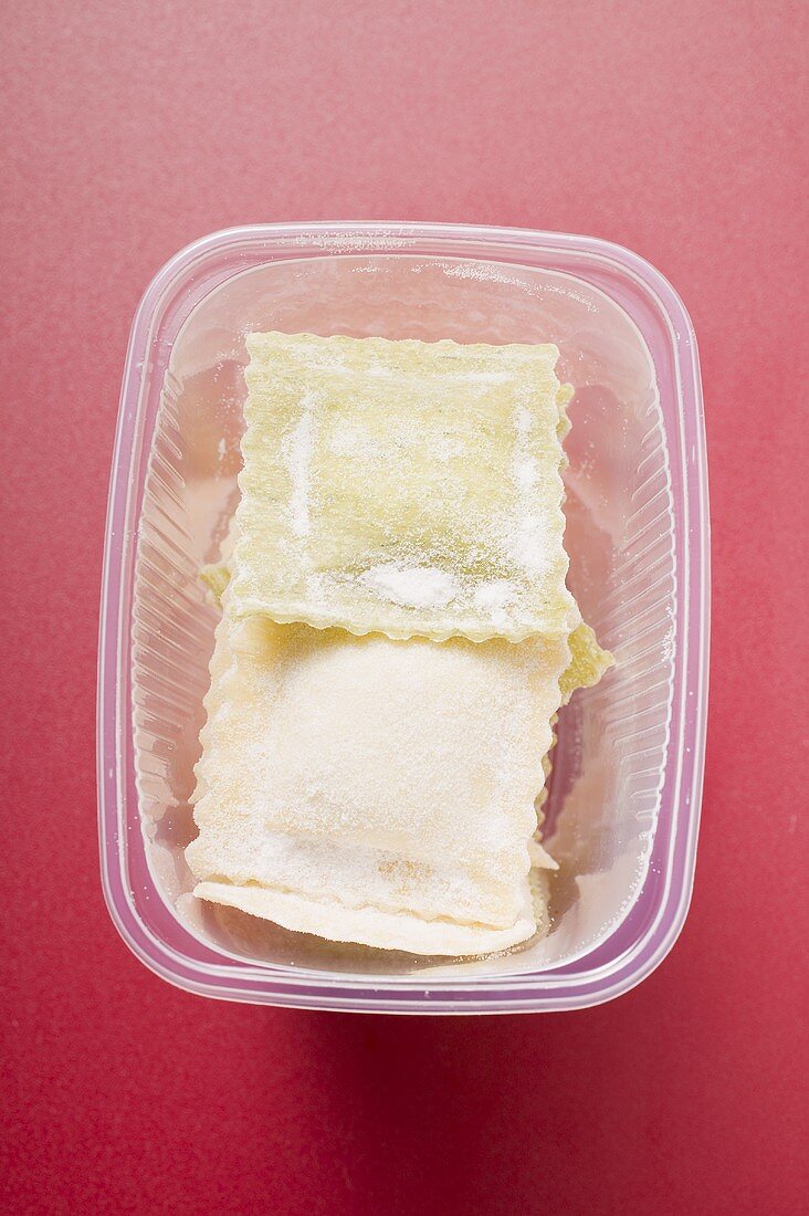 Home-made ravioli in plastic container