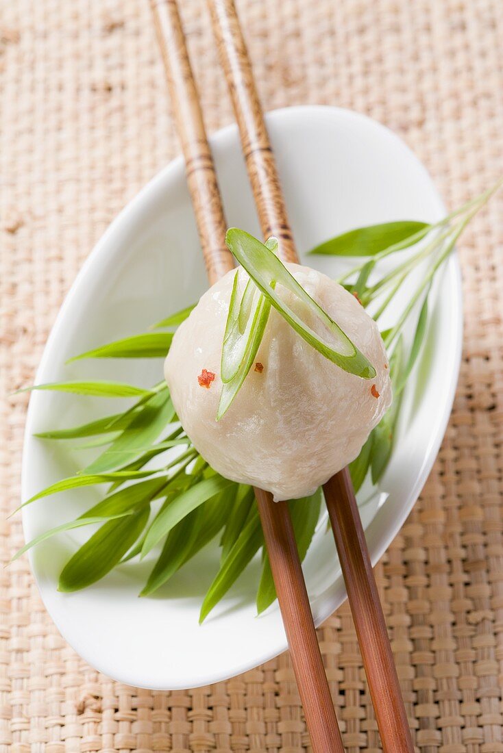 Dim sum on chopsticks (Asia)