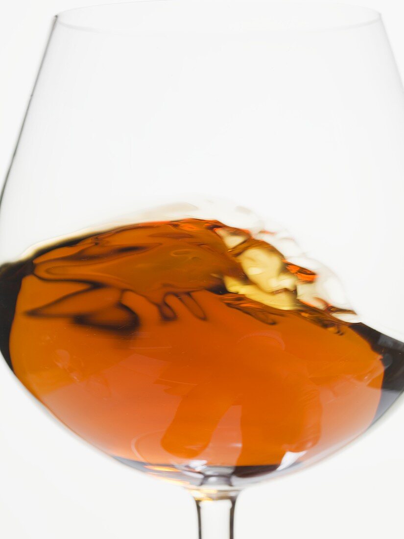 Cognac swirling in a glass