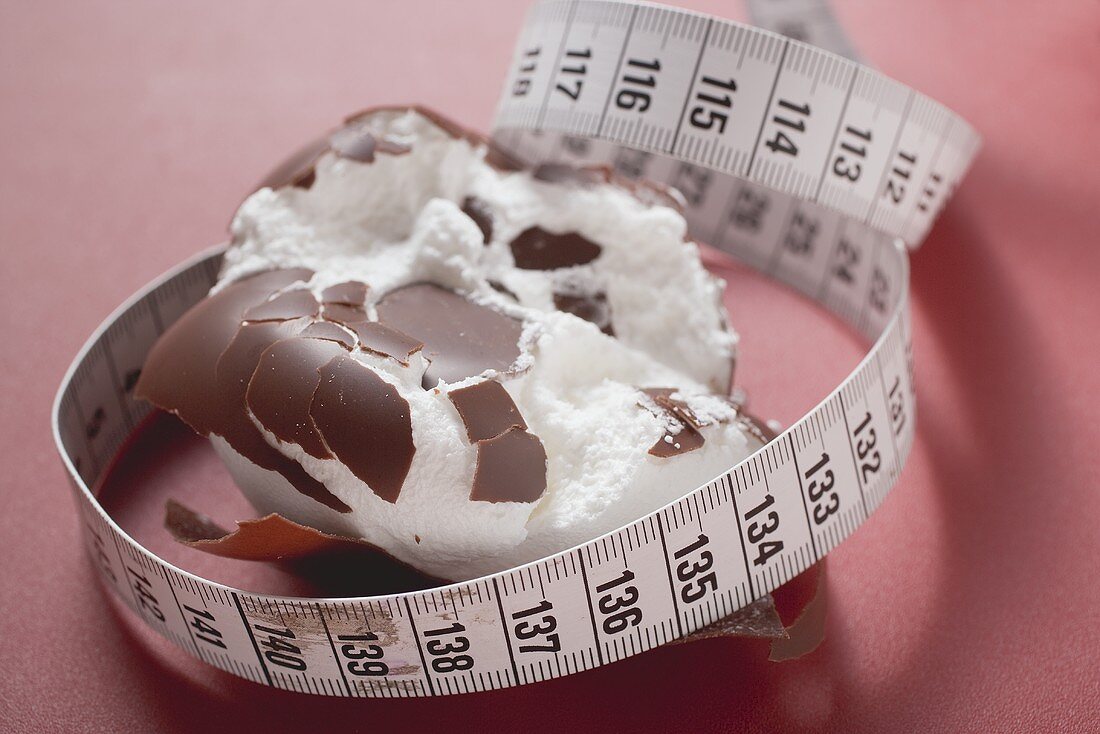 Chocolate-coated marshmallow treat (crushed) with tape measure