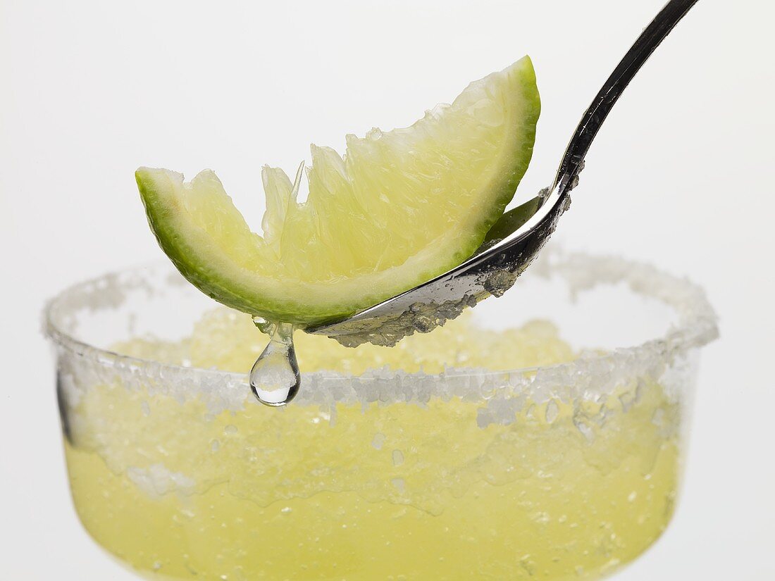 Frozen Margarita, lime wedge on spoon