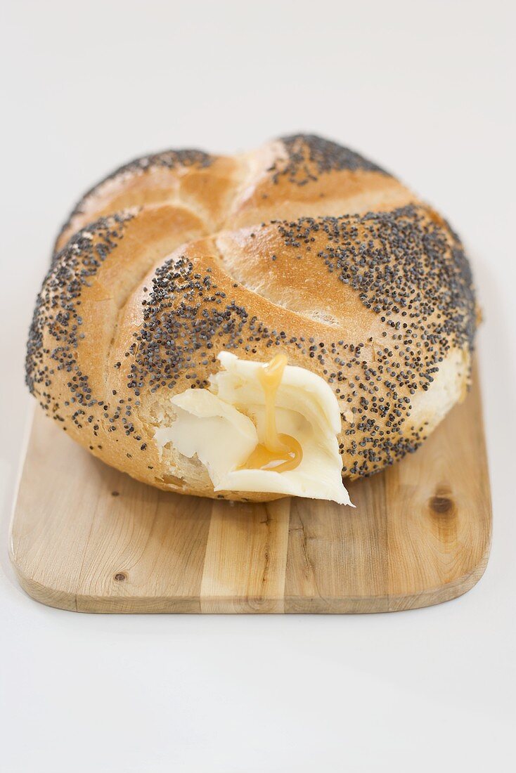 Poppy seed roll with butter and honey