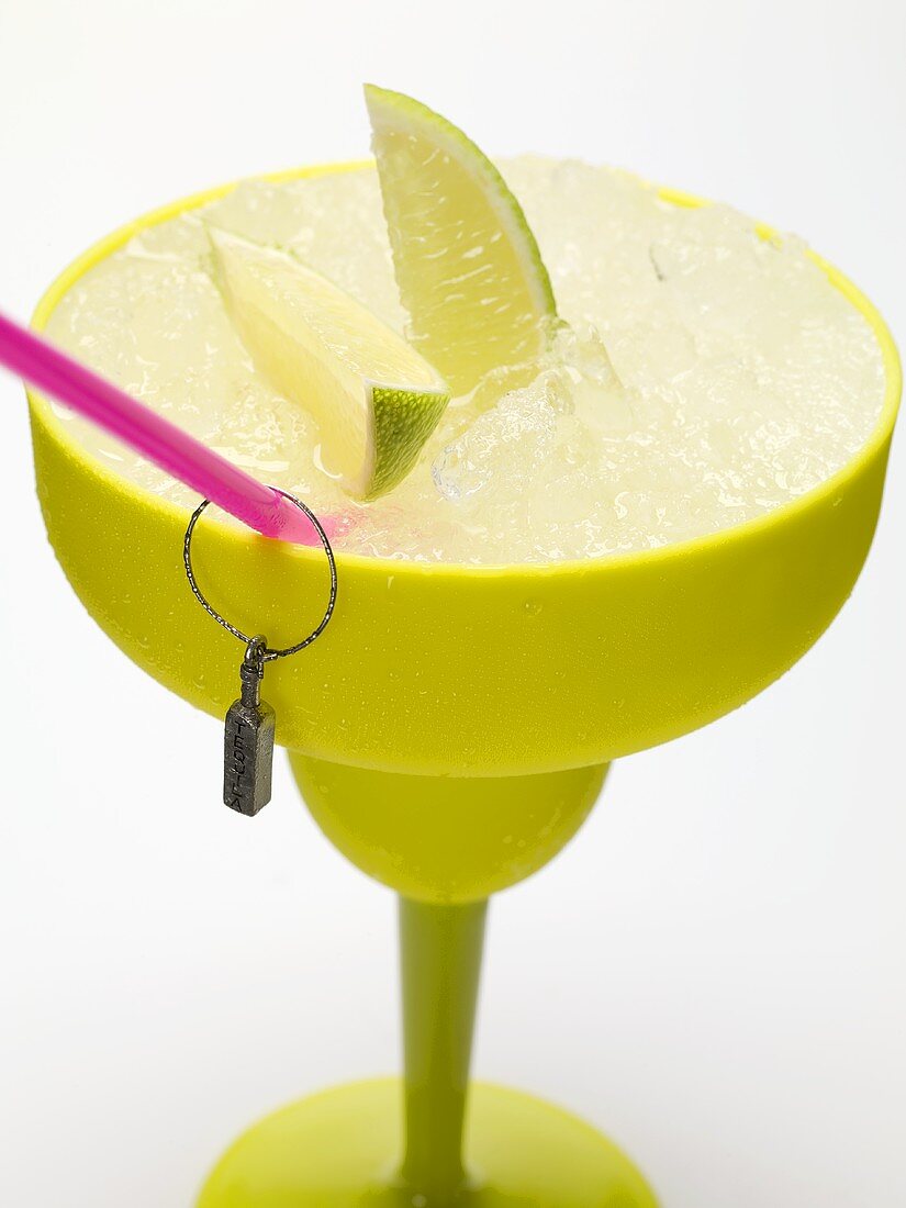 Frozen Margarita with lime wedges