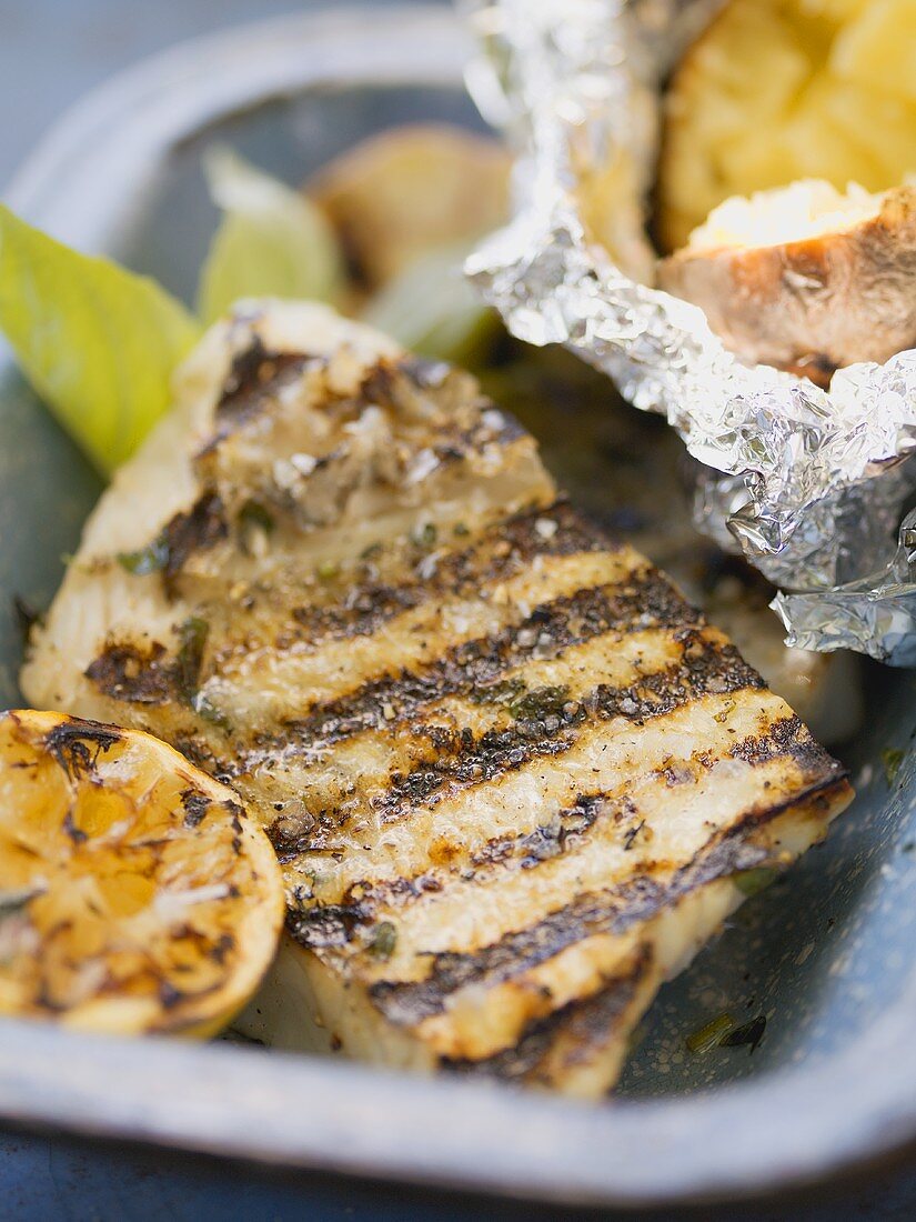 Grilled fish fillet with baked potato