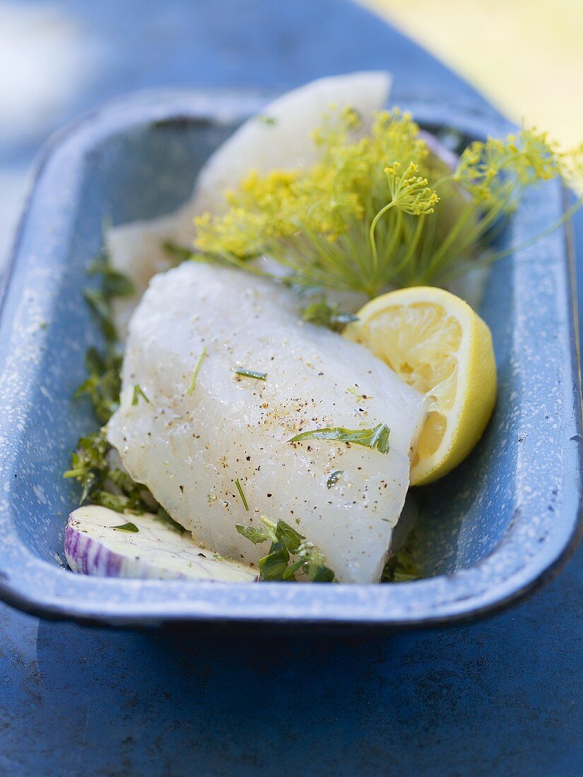 Fish fillets with dill and lemon, ready for grilling