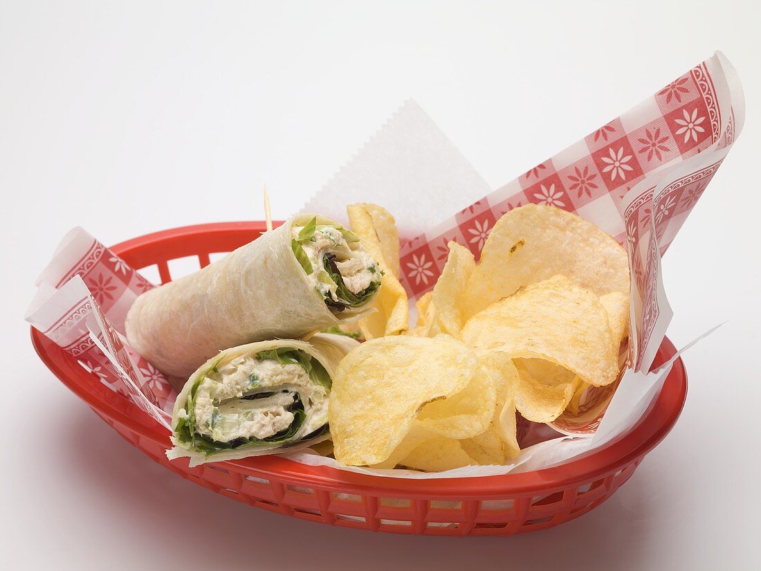 Wraps with crisps in a plastic basket