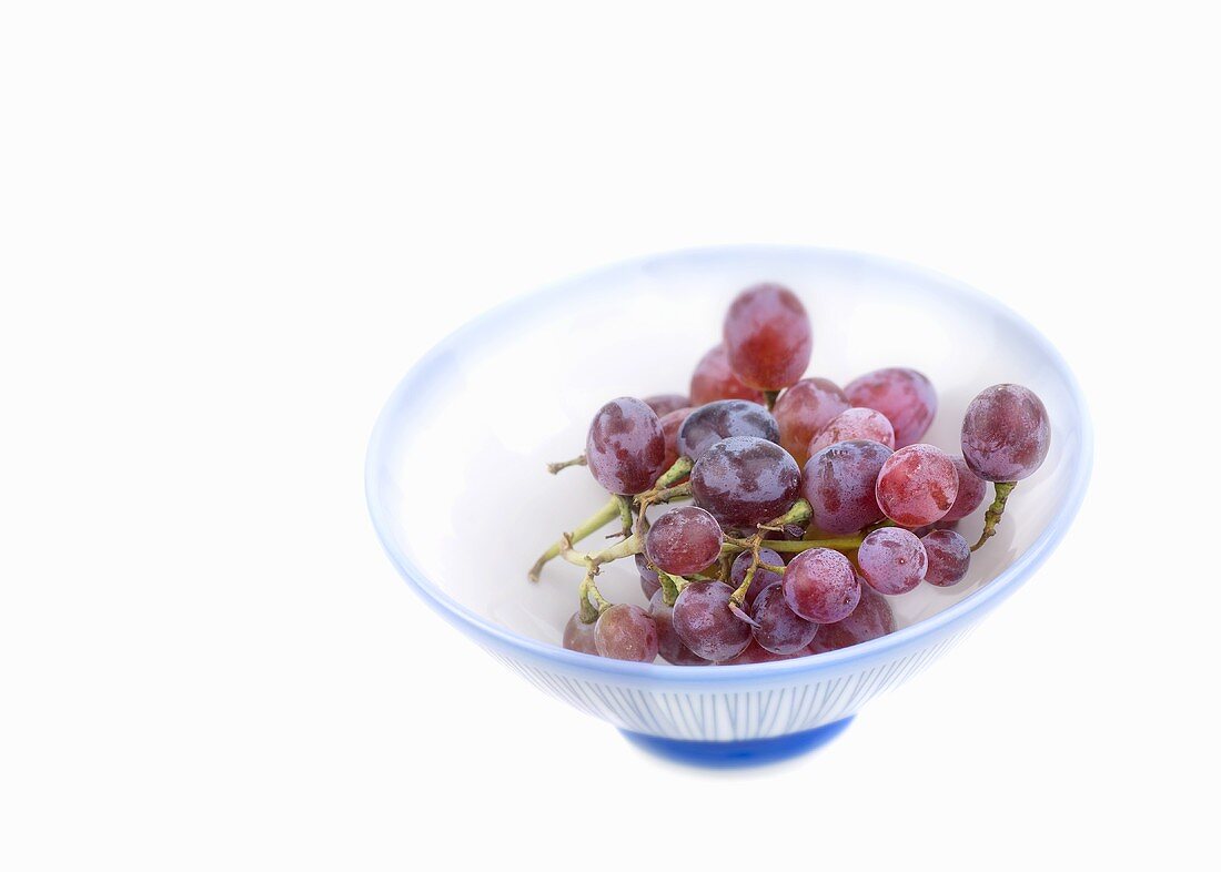 Red grapes in striped dish