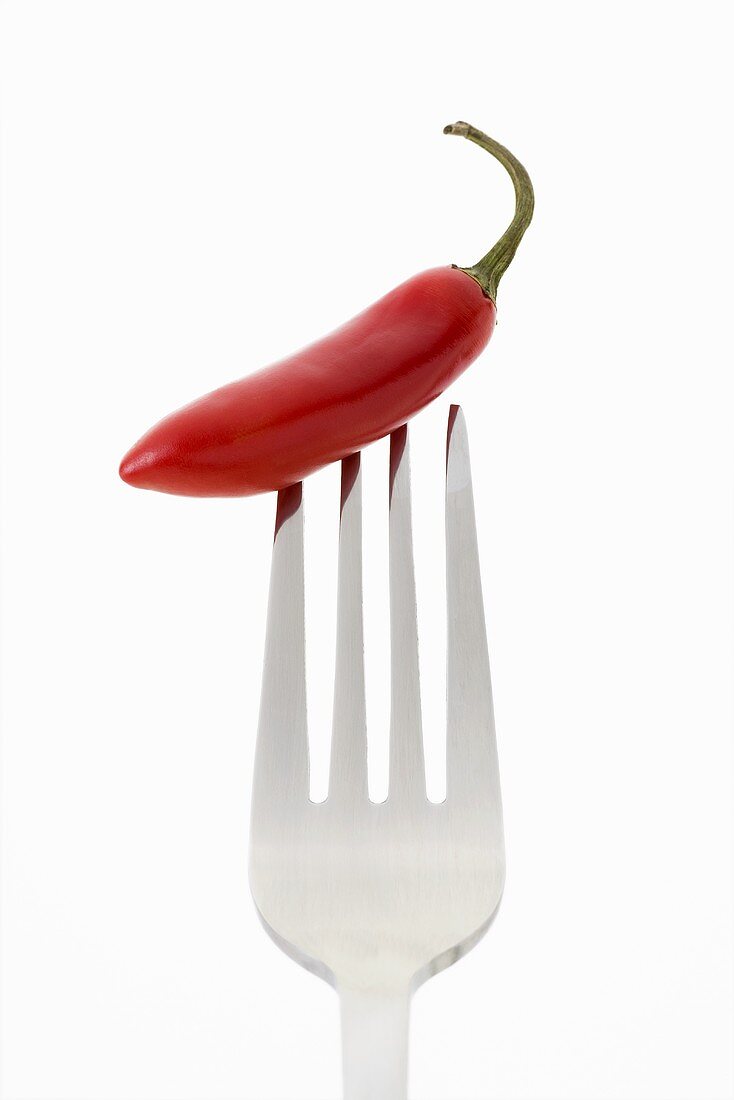 A red chilli on a fork