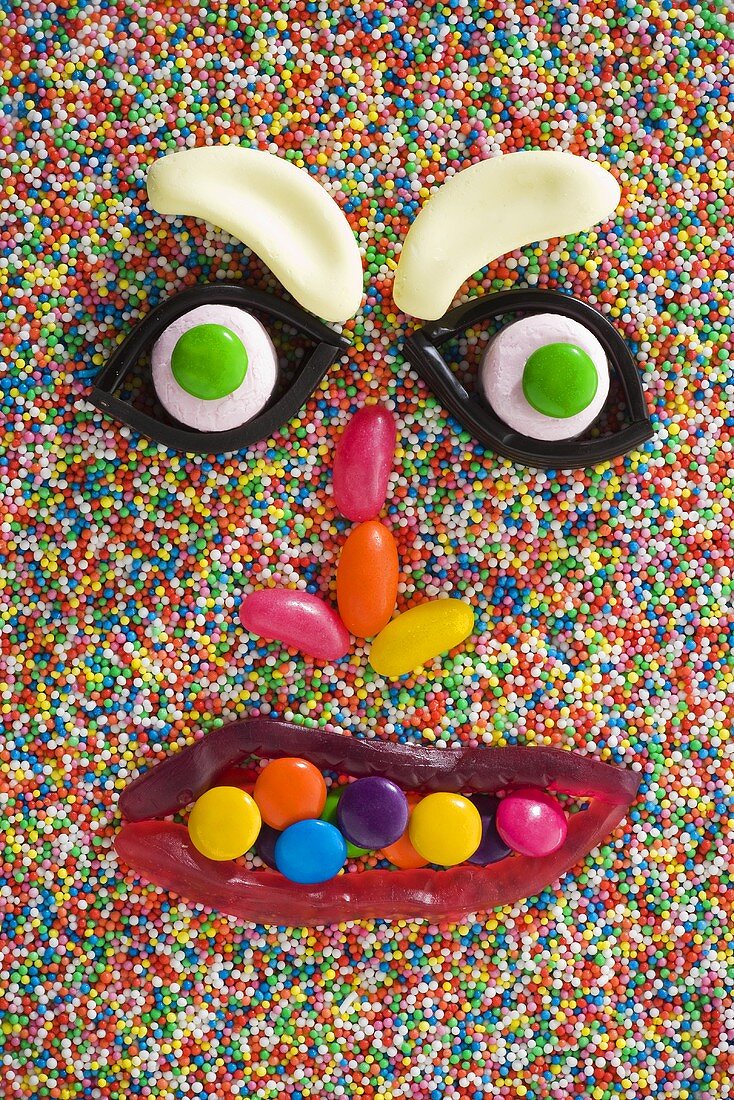 A face made from sweets on hundreds and thousands