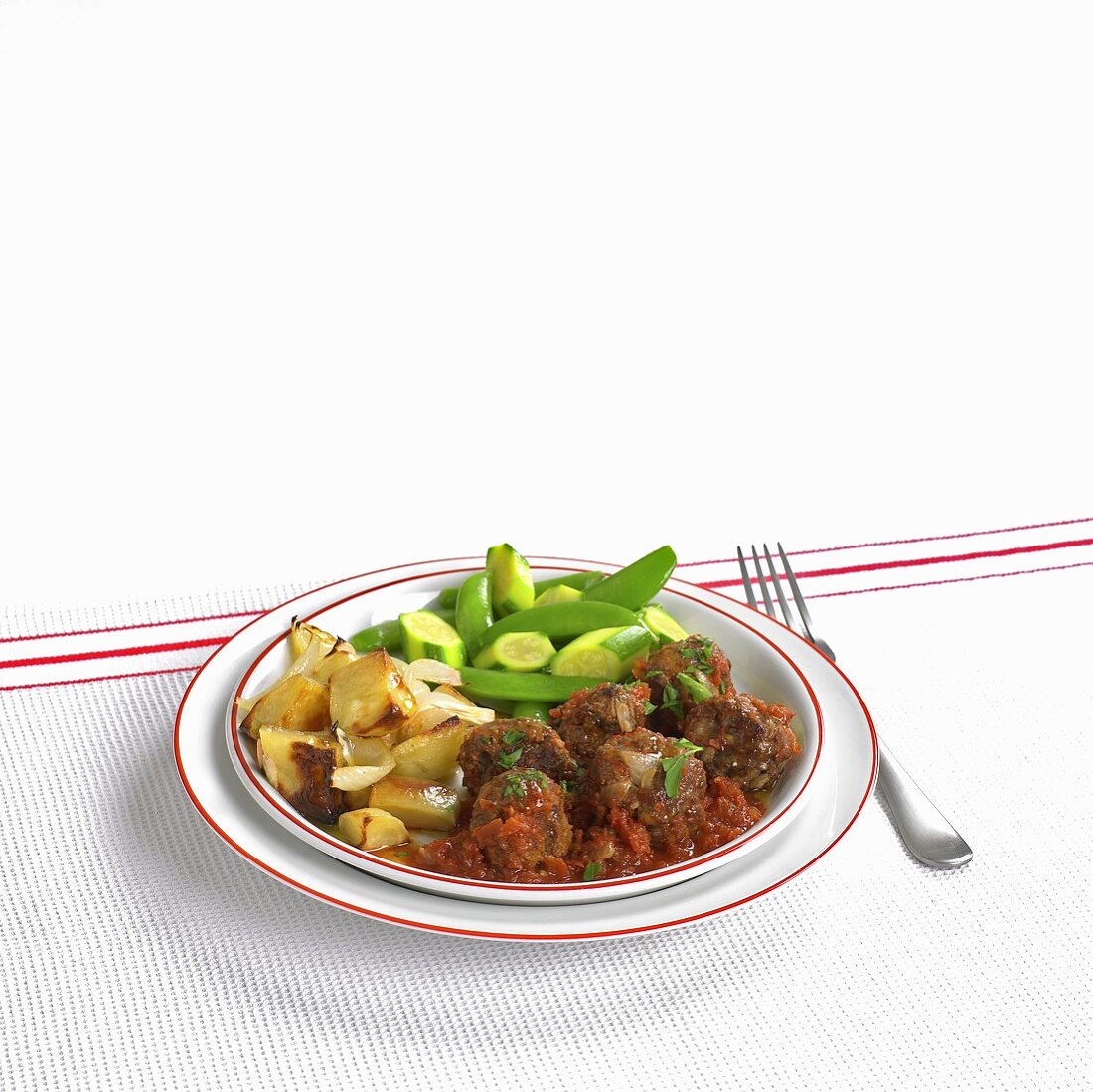 Meatballs with tomato sauce and vegetables