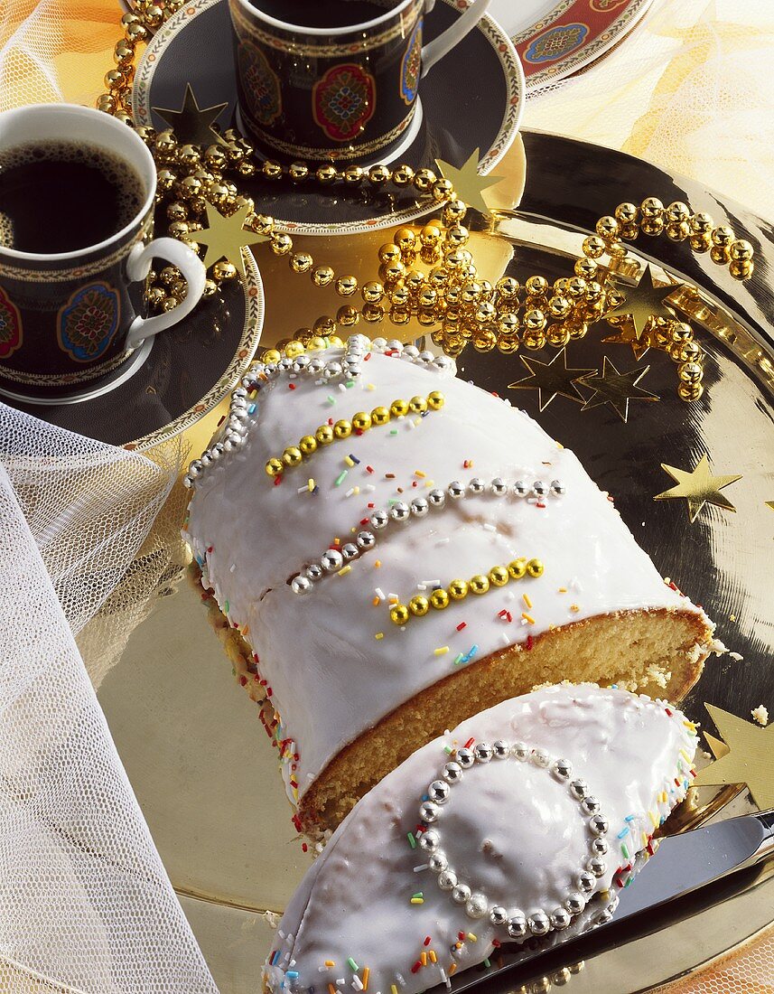 Iced Christmas bell cake with mandarin orange juice