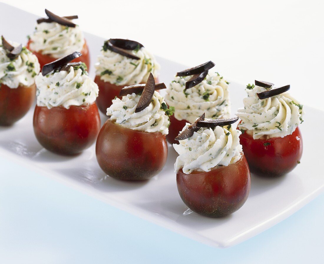 Black cherry tomatoes with soft cheese stuffing