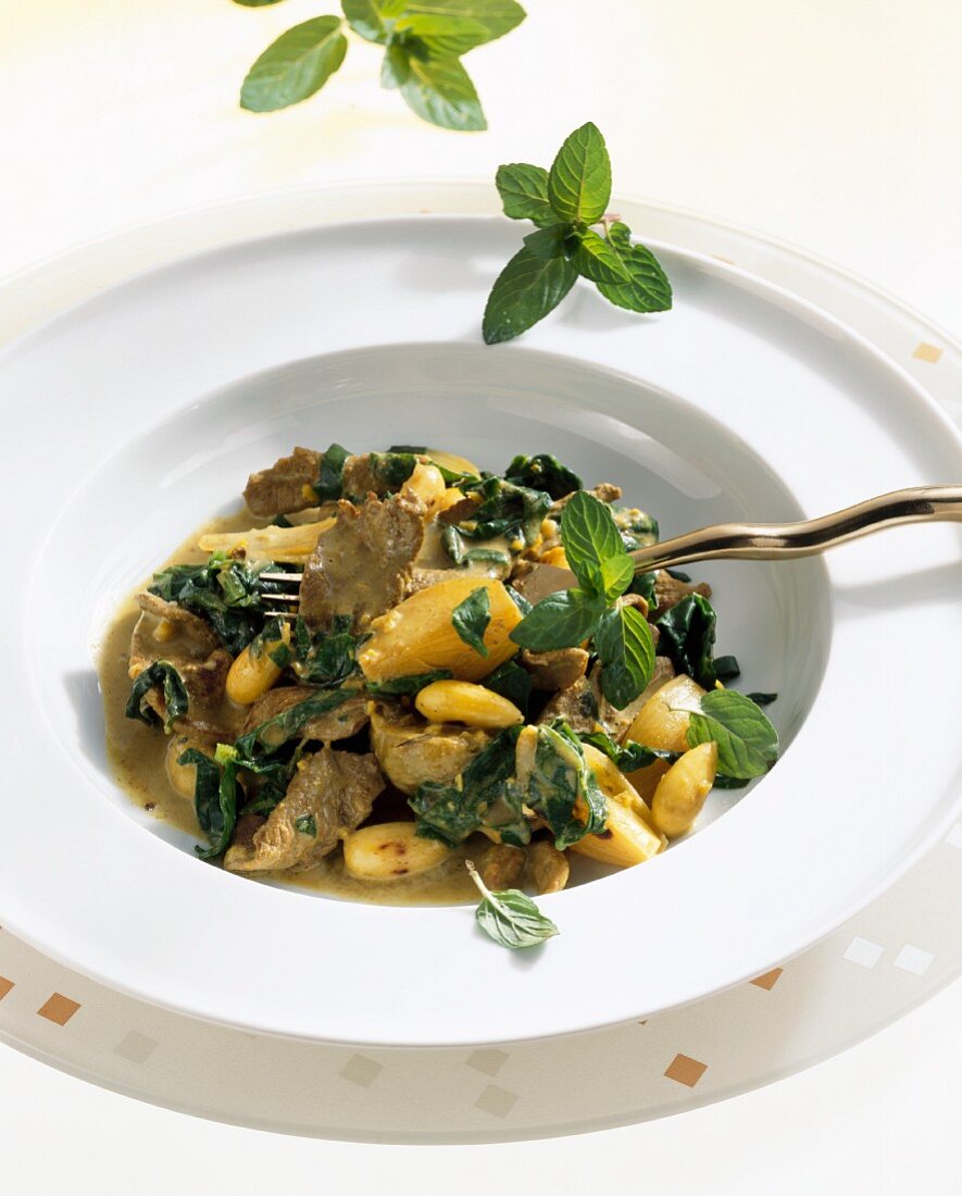 Duck curry with almonds, coconut milk and mint