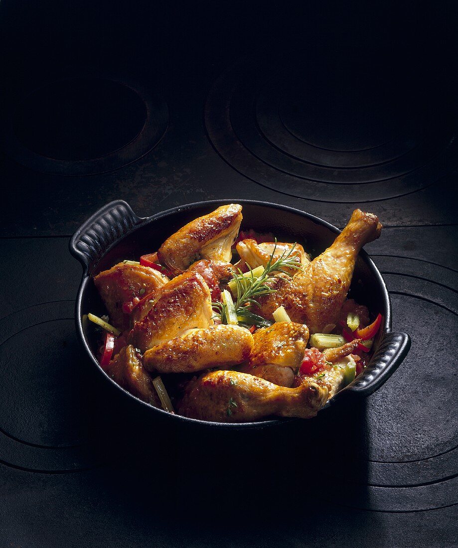 Fried chicken with vegetables in a pot