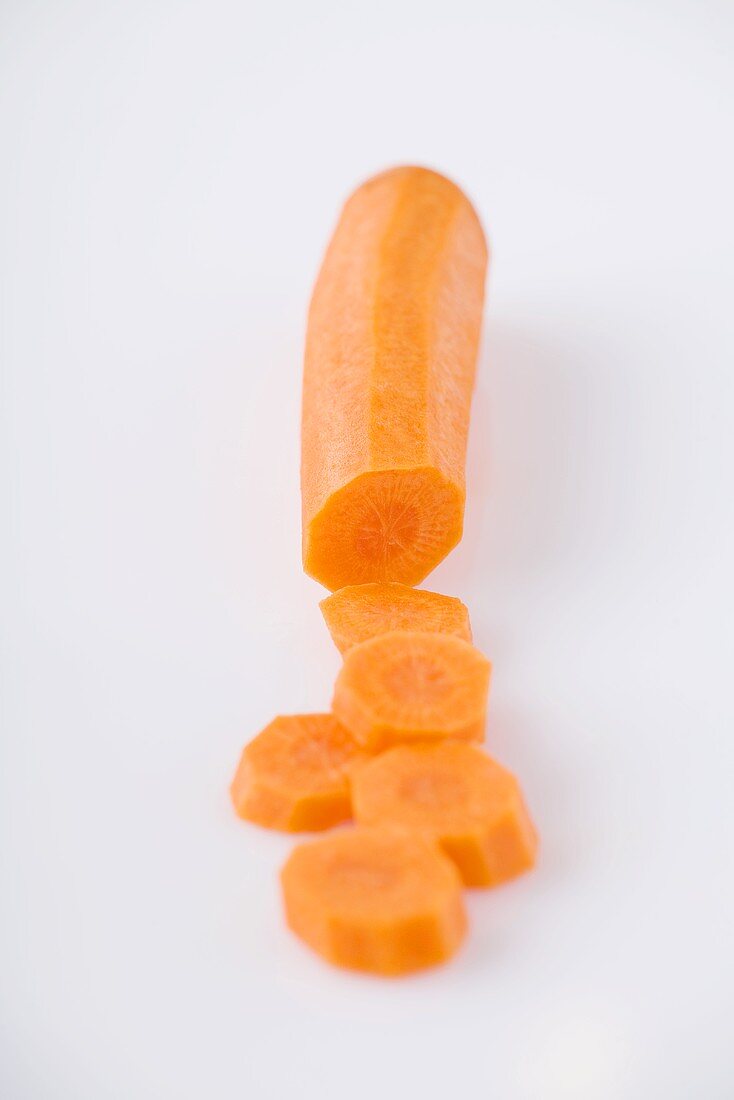 A carrot, partly sliced