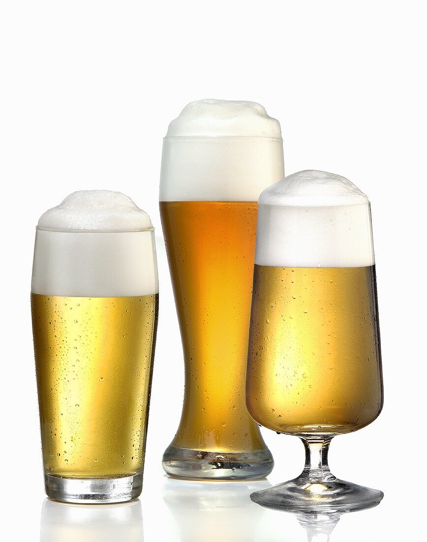 Three different glasses of beer