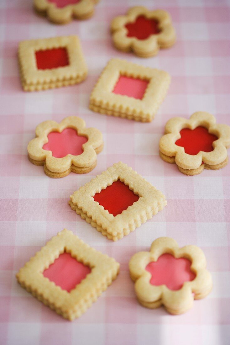 Pink and Red Filled Cookies on Checked Cloth