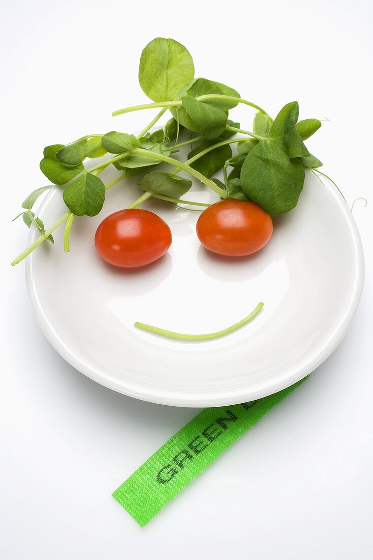 Vegetable face in a soup plate, label beside it