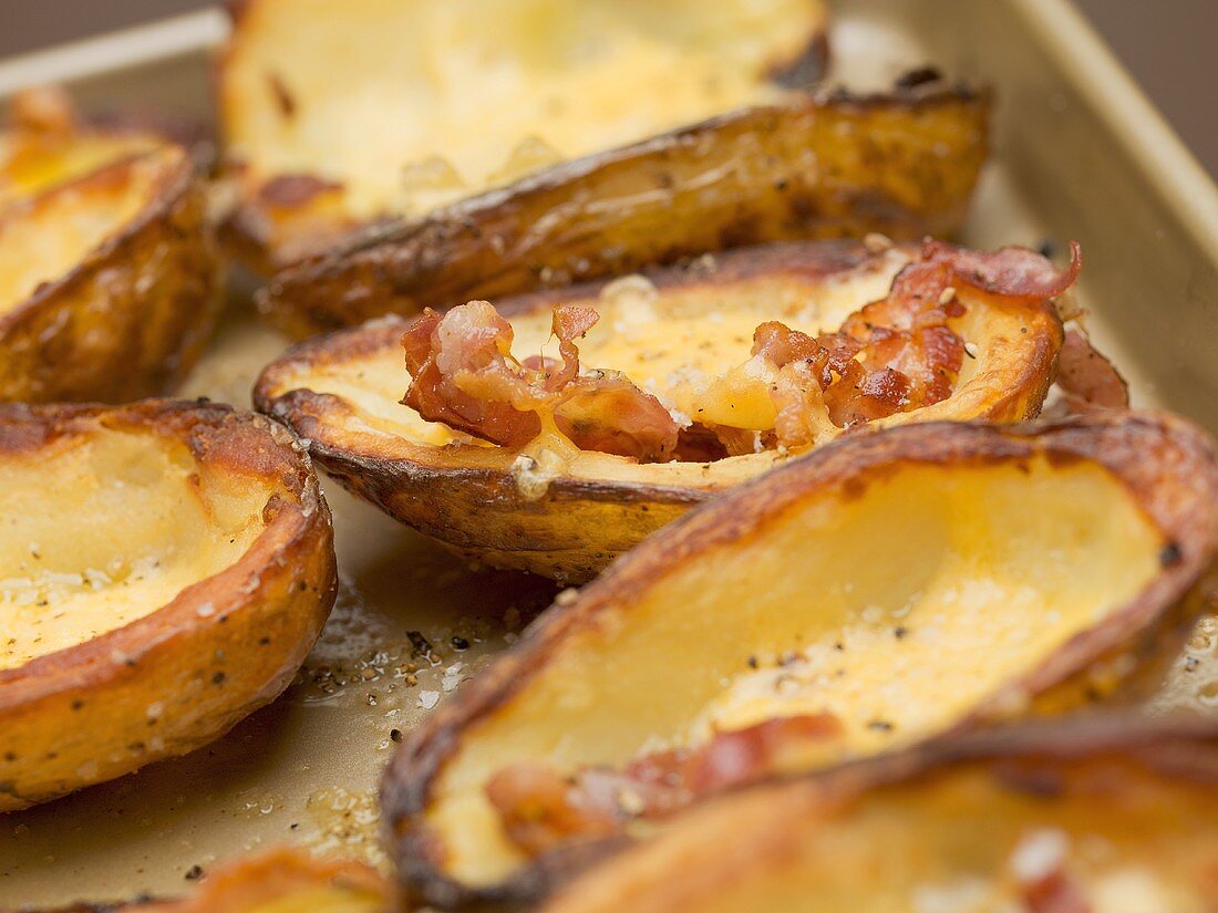 Baked potato skins with bacon (close-up)