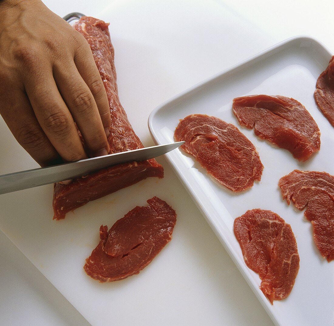 Thinly slicing beef fillet