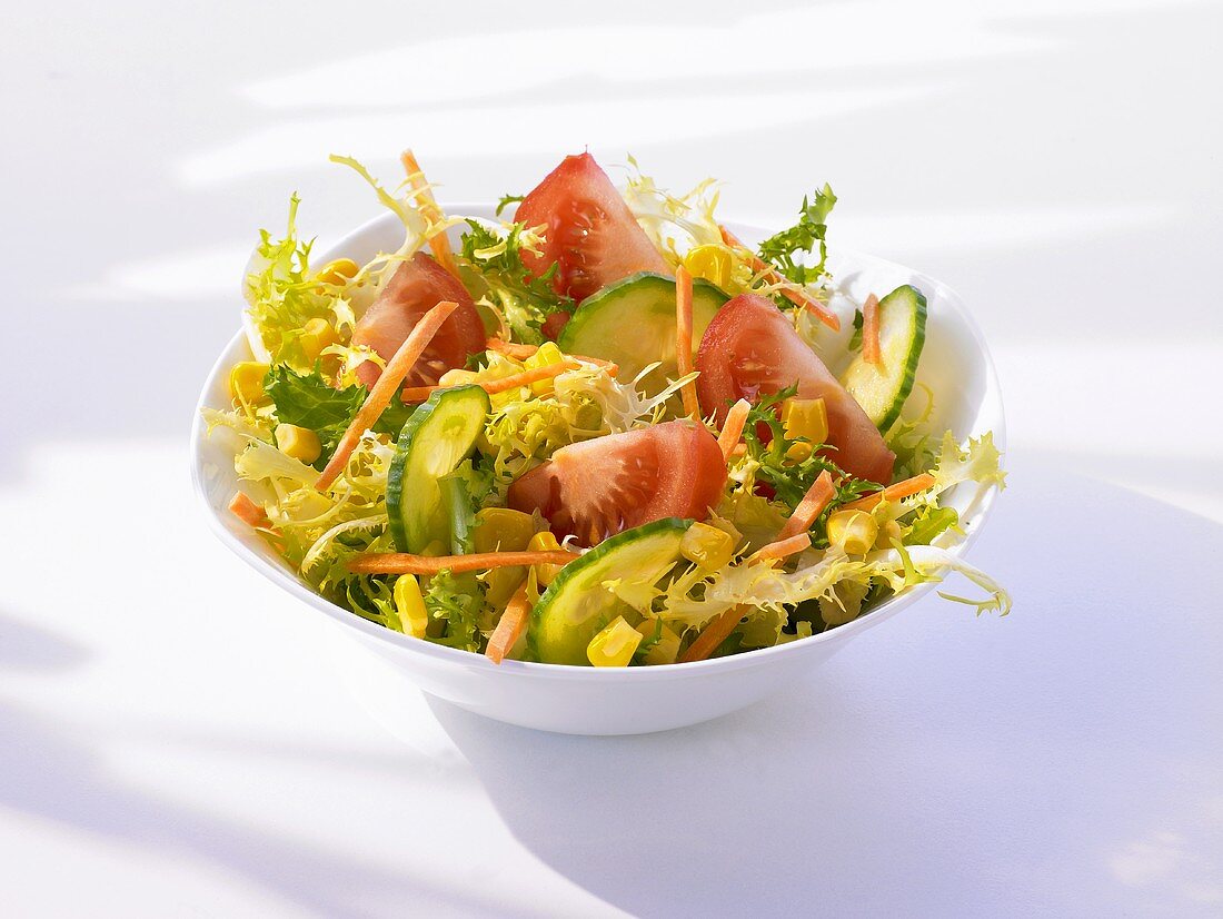 Frisée with cucumber, tomato, sweetcorn and carrot