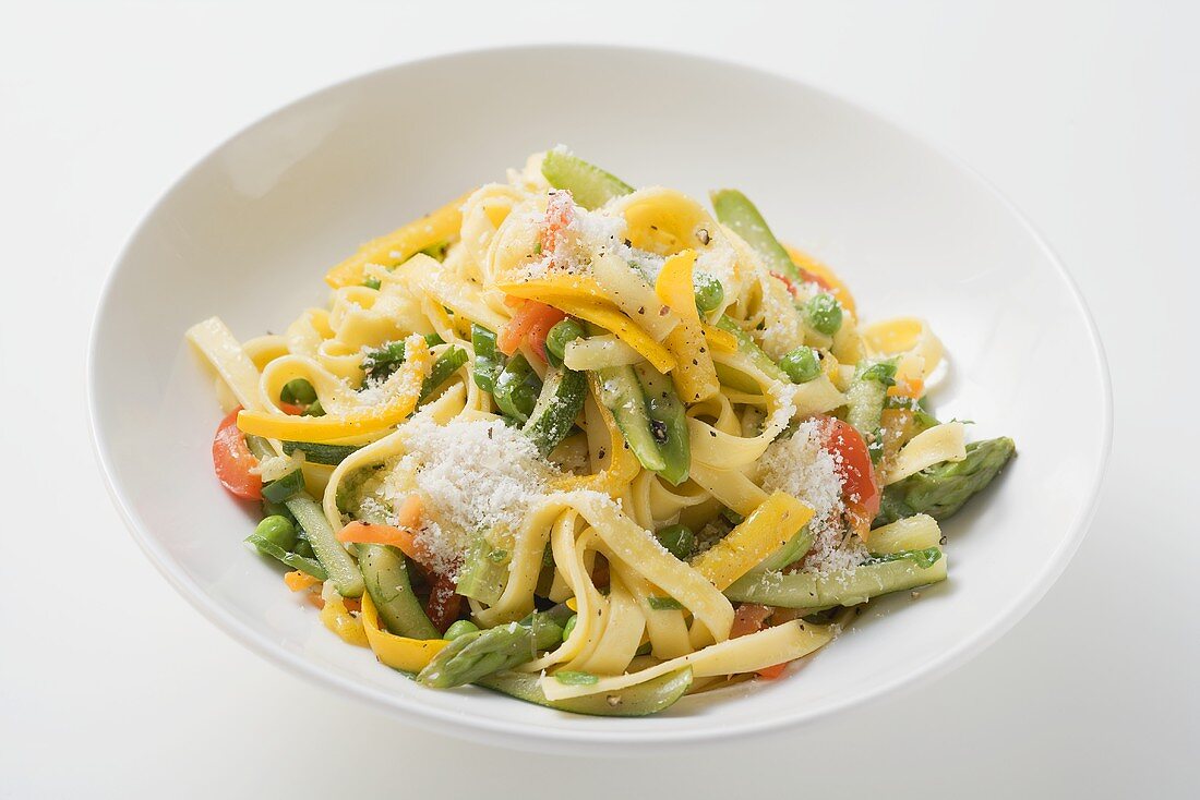 Tagliatelle primavera with vegetables and grated cheese