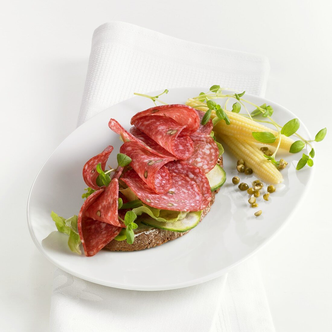 Pepper salami and salad on bread