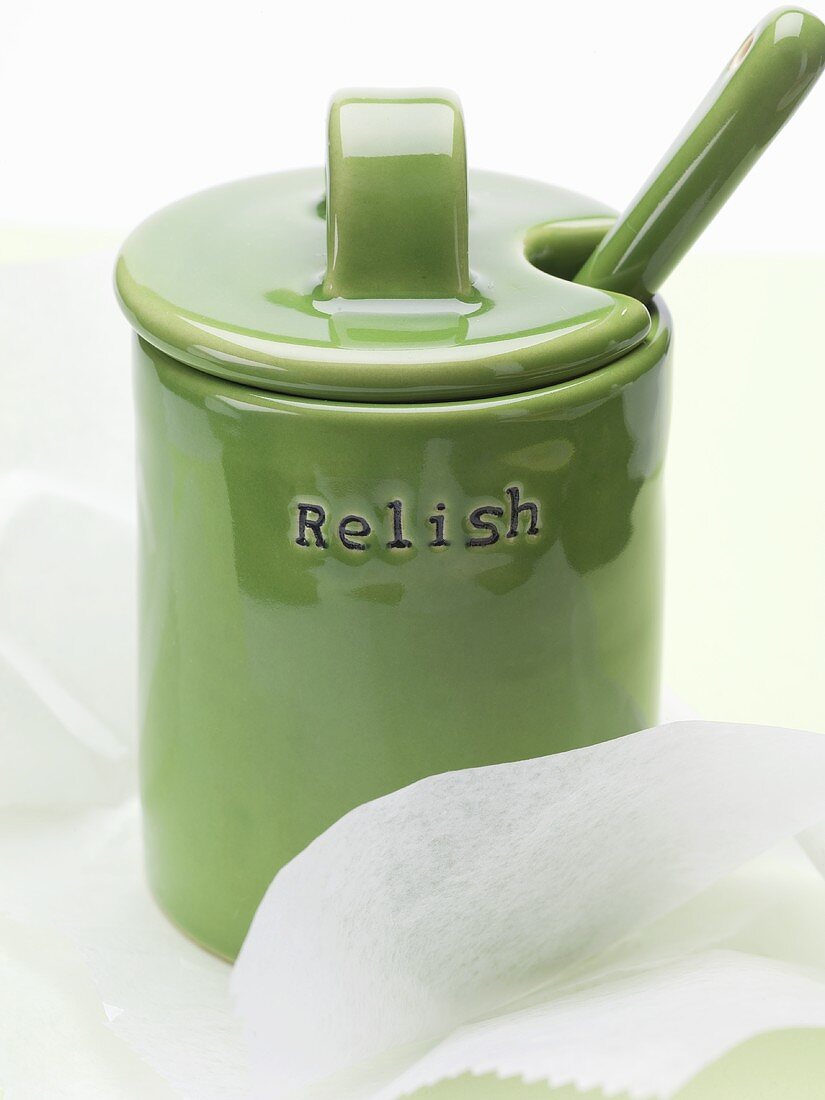 A green ceramic pot with lid and the word 'Relish'