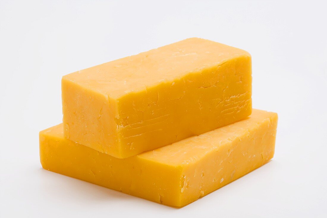 Two pieces of Cheddar cheese