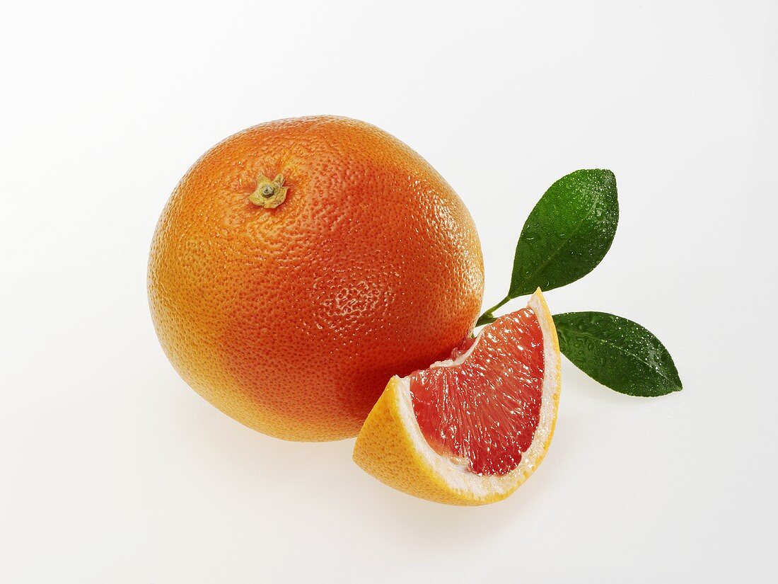 Pink grapefruit with leaves
