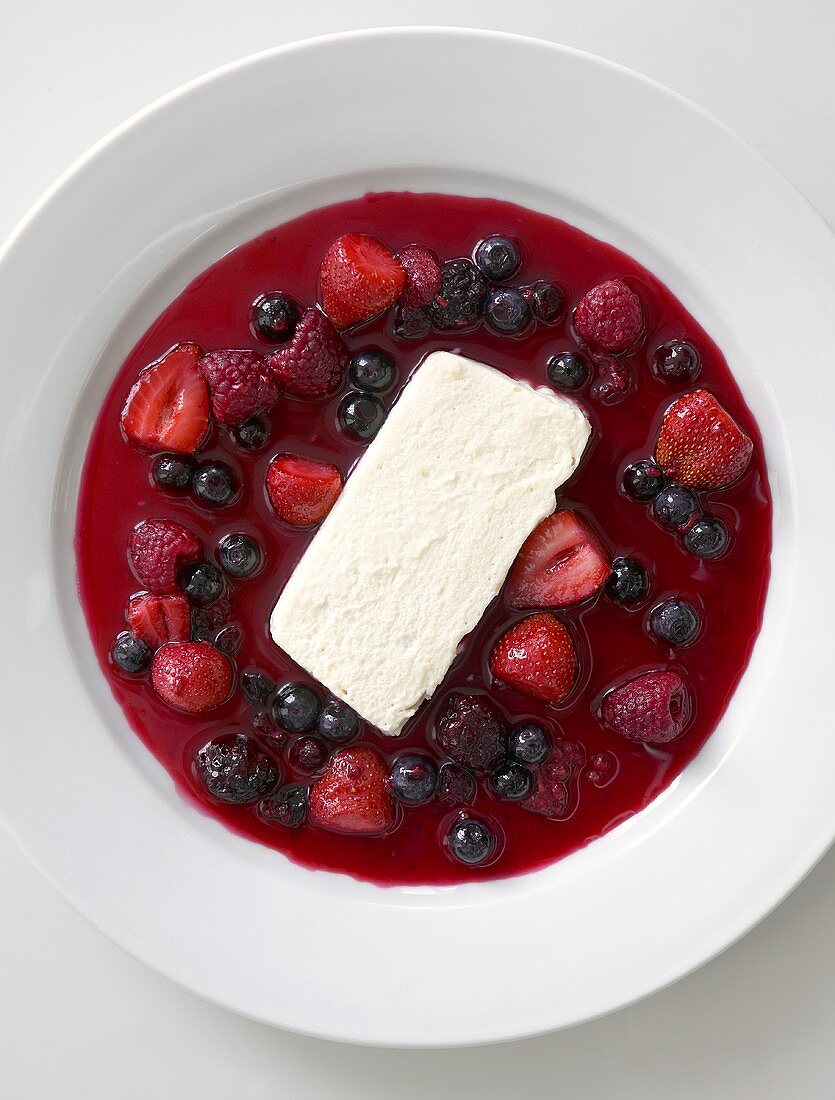 White chocolate mousse with berry sauce (overhead view)