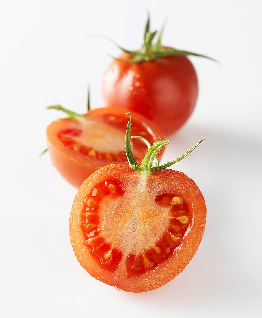 Tomatoes, one whole and one halved
