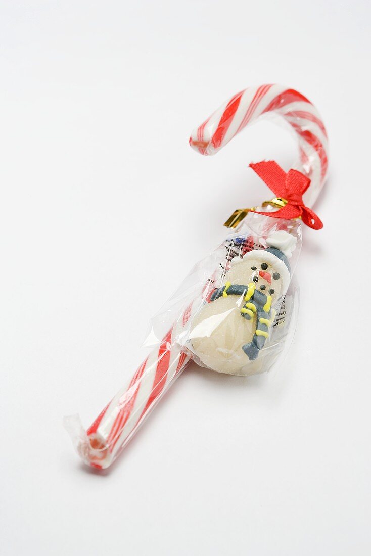 Candy cane and marzipan snowman (in packaging)