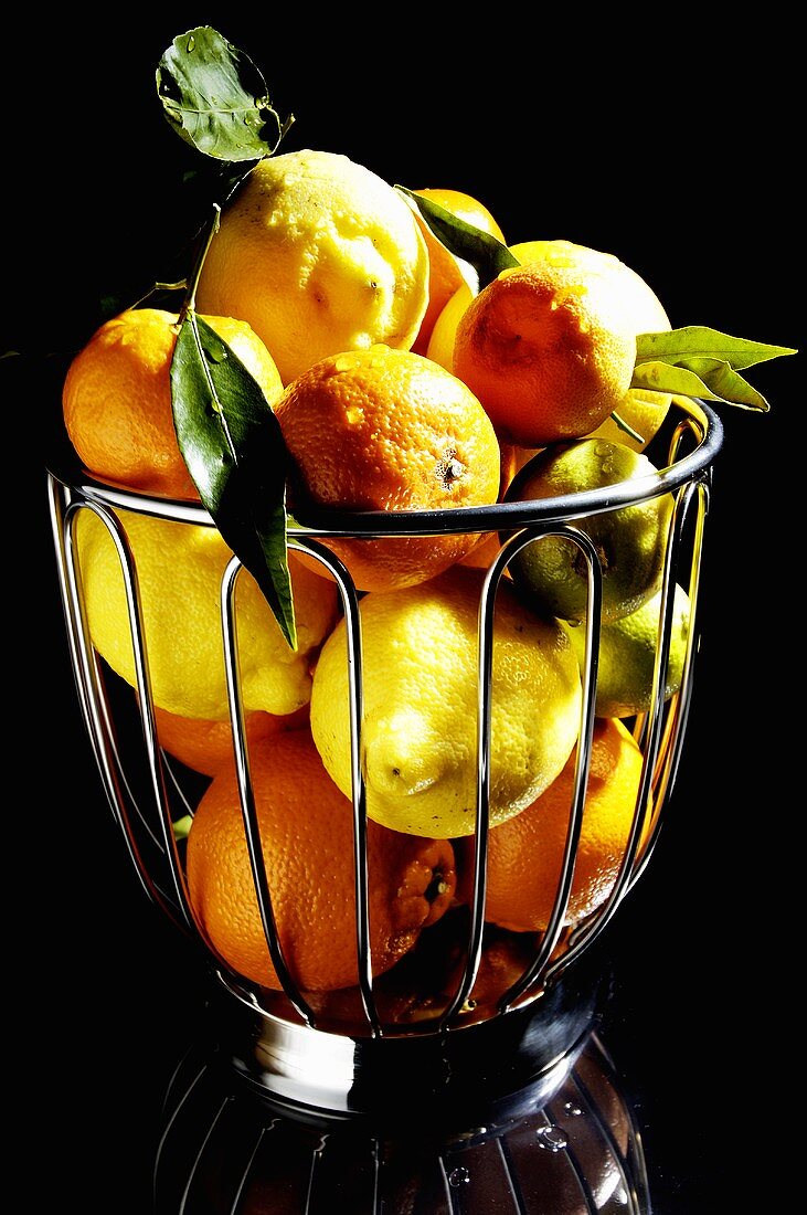 A basket of assorted citrus fruit