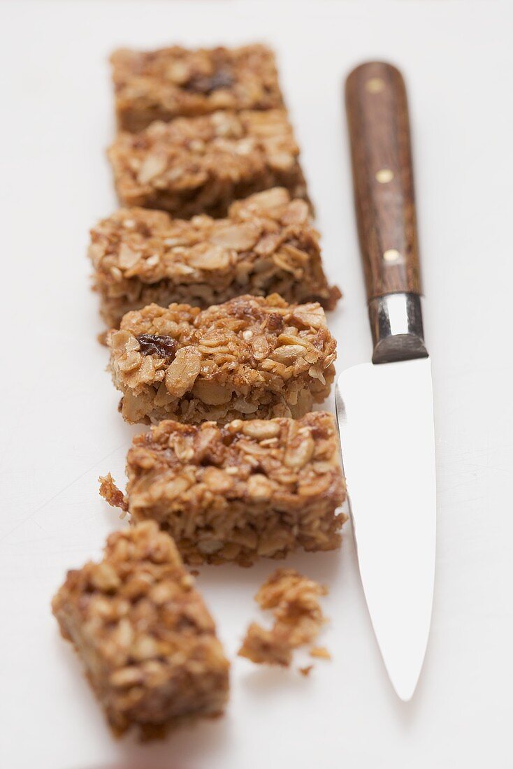 Muesli slices, knife beside them