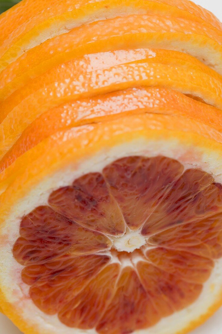 Slices of blood orange in a row (close-up)