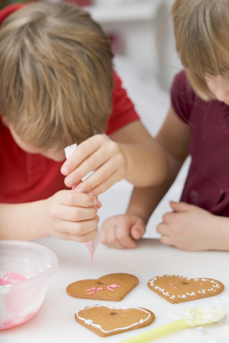 Children decorating biscuits