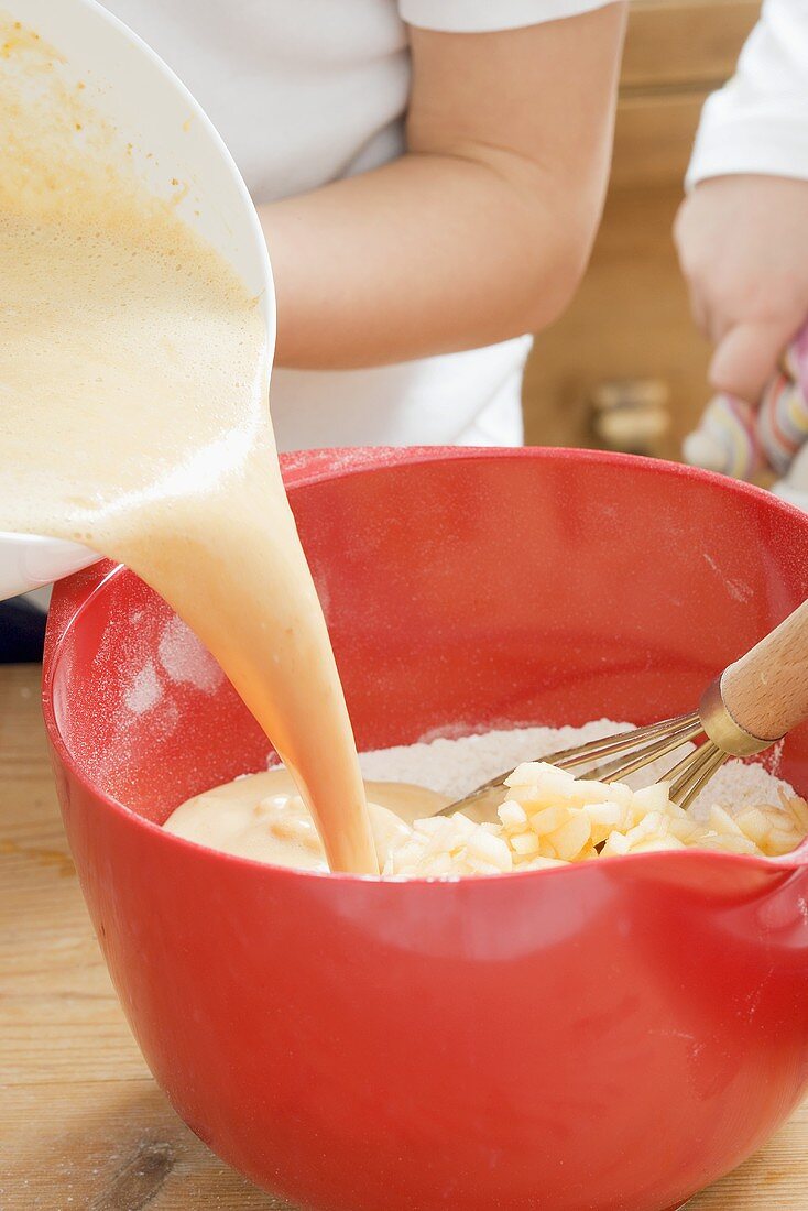 Children making muffin mixture