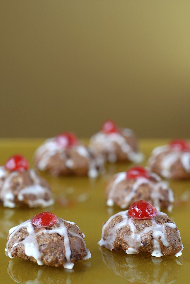 Iced cardinal macaroons with cherries