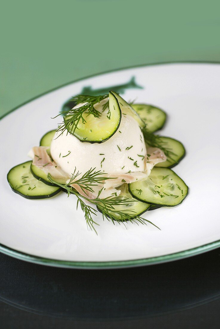 Trout mousse on cucumber slices with dill