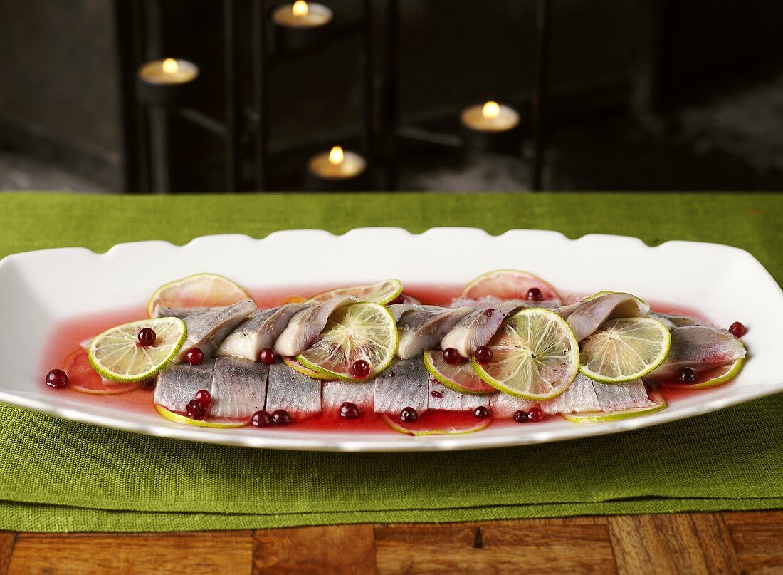 Marinated herring with cranberry sauce and lime slices (Christmas)