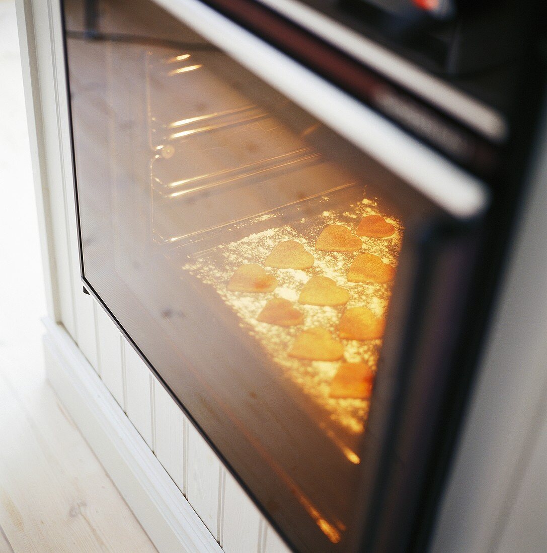 Heart-shaped biscuits in the oven