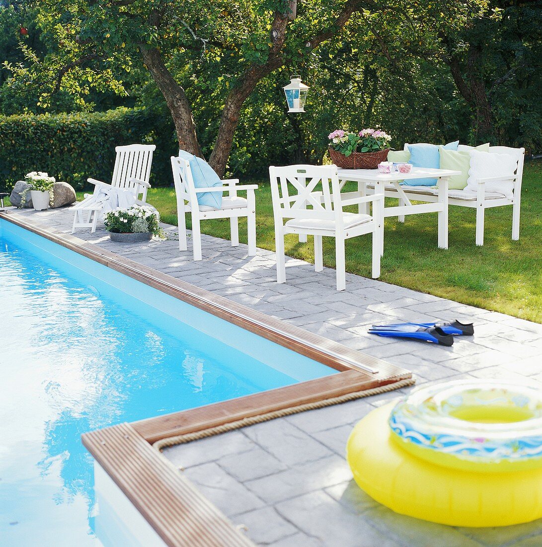 Swimming pool, rubber rings, garden furniture