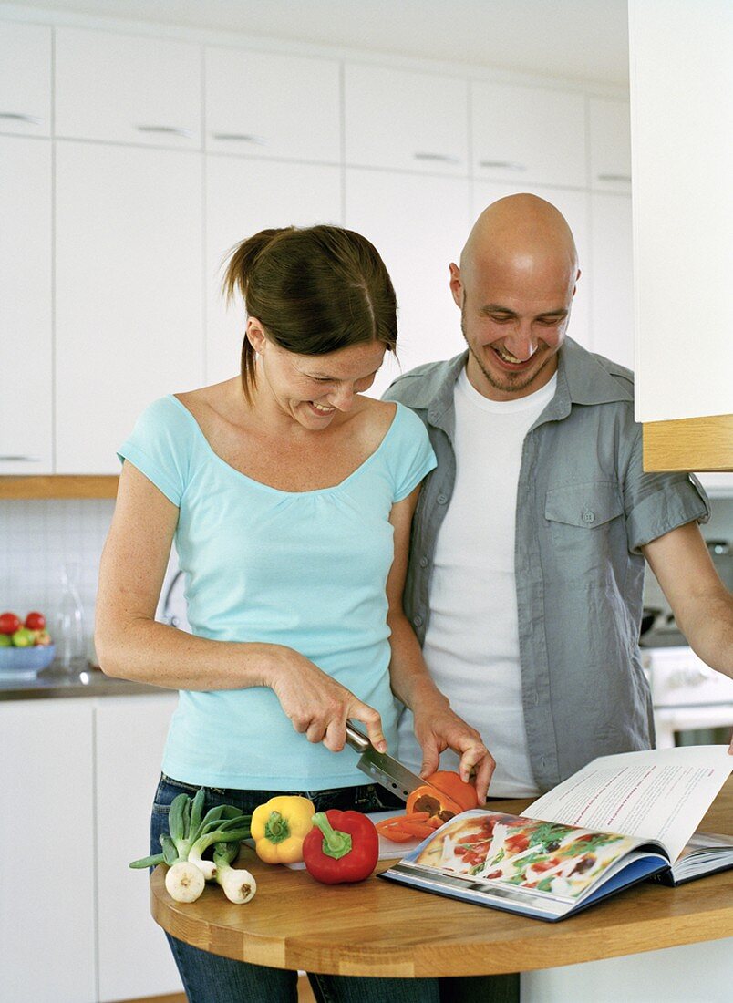 Man and woman making a meal together