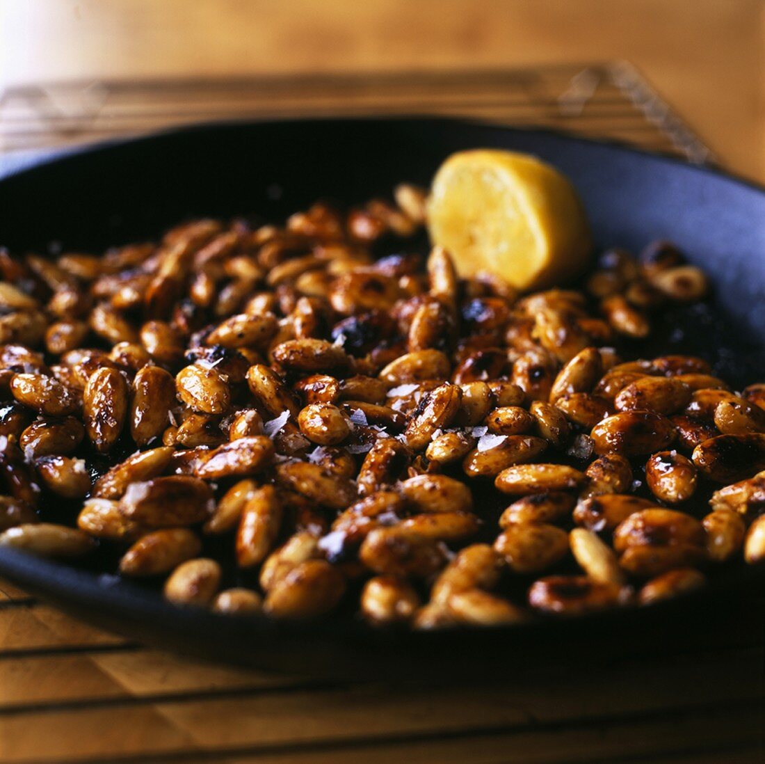 Caramelised almonds in a frying pan